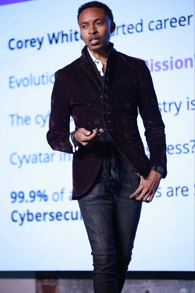 Corey White speaking on stage — Cybersecurity Keynote Speaker
