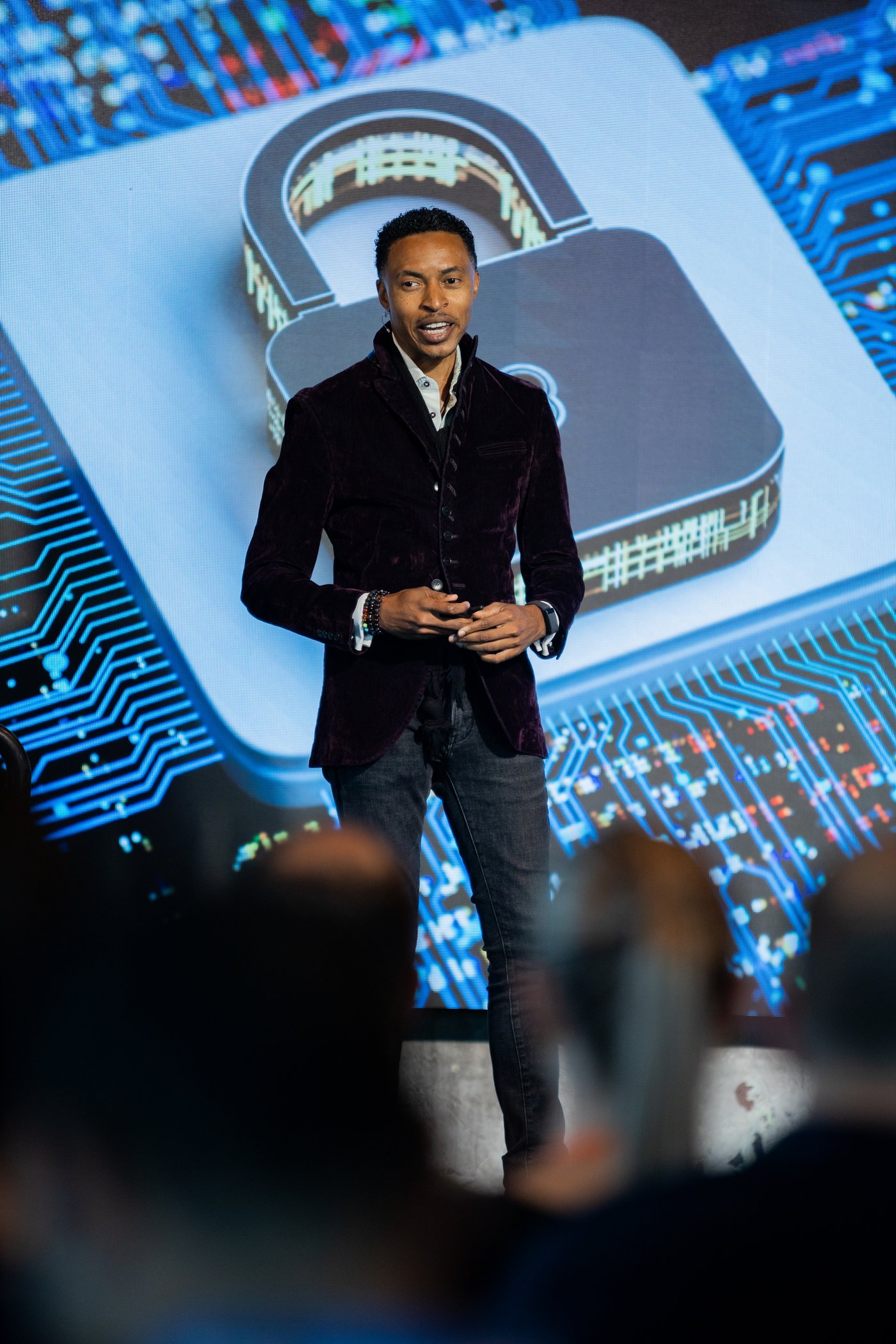 Corey White on stage delivering a cybersecurity keynote